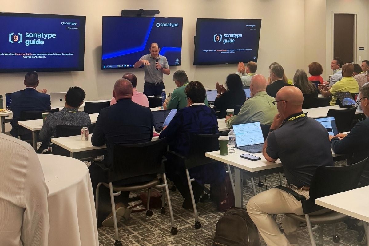 Sonatype employees in a meeting learning about product roadmap.